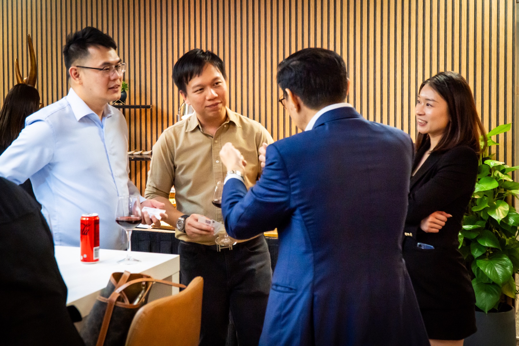 Guests in conversation at a Golden Acacia Hub event